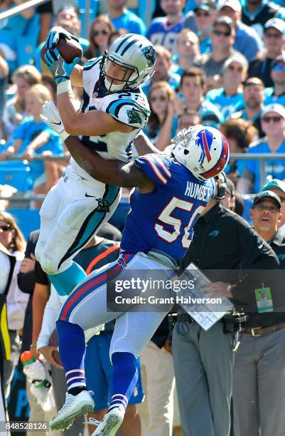 Christian McCaffrey of the Carolina Panthers makes a catch against Ramon Humber of the Buffalo Bills during their game at Bank of America Stadium on...