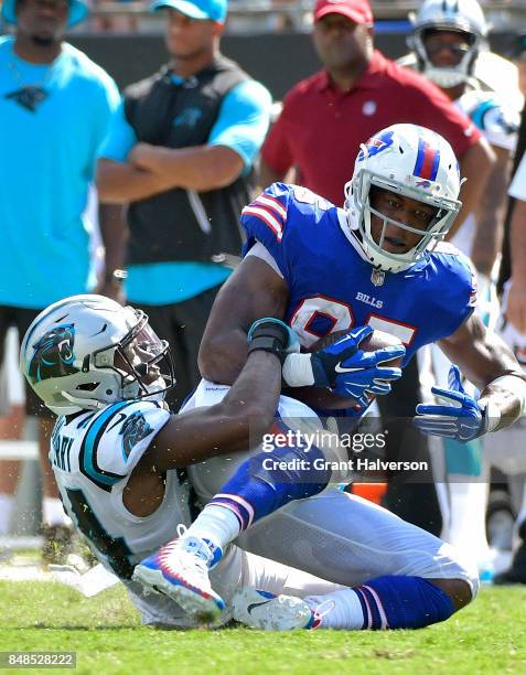 Charles Clay of the Buffalo Bills makes a catch against James Bradberry of the Carolina Panthers during their game at Bank of America Stadium on...