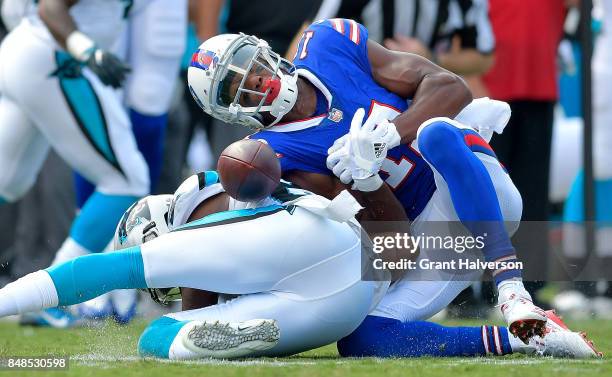 James Bradberry of the Carolina Panthers separates Zay Jones of the Buffalo Bills from the ball during their game at Bank of America Stadium on...