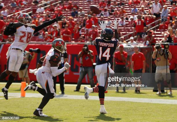 Wide receiver Deonte Thompson of the Chicago Bears catches a 14-yard touchdown pass from quarterback Mike Glennon while getting pressure from...