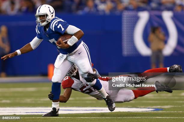Jacoby Brissett of the Indianapolis Colts is tackled by Josh Bynes of the Arizona Cardinals during the second half at Lucas Oil Stadium on September...