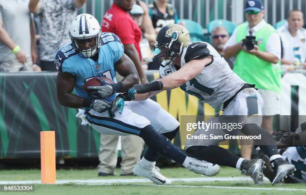 Jonnu Smith of the Tennessee Titans scores a 32-yard touchdown the second half in front of Paul Posluszny of the Jacksonville Jaguars at EverBank...