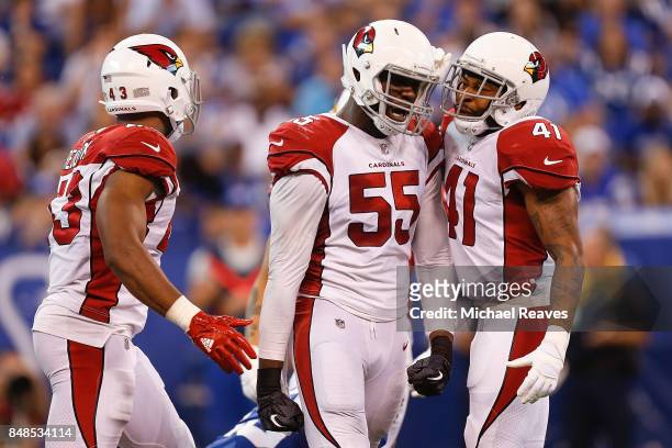 Chandler Jones of the Arizona Cardinals celebrates with Antoine Bethea and Haason Reddick after a sack against the Indianapolis Colts during the...