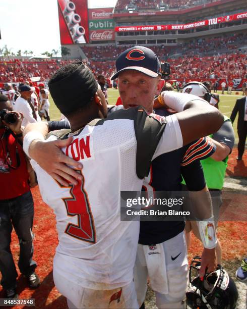 Quarterback Jameis Winston of the Tampa Bay Buccaneers and quarterback Mike Glennon of the Chicago Bears meet up on the field following an NFL...