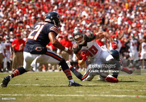 Wide receiver Adam Humphries of the Tampa Bay Buccaneers is stopped by defensive back Marcus Cooper of the Chicago Bears and strong safety Quintin...