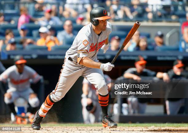 Seth Smith of the Baltimore Orioles hits into a fifth inning run scoring fielders choice against the New York Yankees at Yankee Stadium on September...