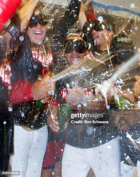 Jose Ramirez of the Cleveland Indians and teamates celebrate winning the American League Central Division championship after beating the Kansas City...