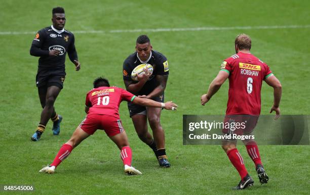 Nathan Hughes of Wasps runs with the ball during the Aviva Premiership match between Wasps and Harlequins at The Ricoh Arena on September 17, 2017 in...