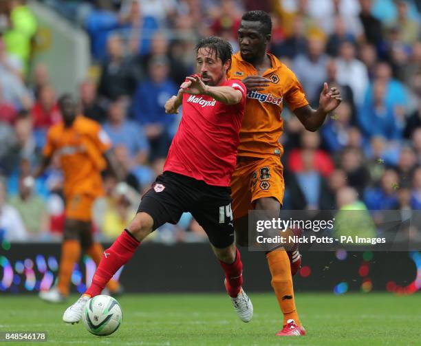 Cardiff City's Tommy Smith holds off Wolverhampton Wanderers' Tongo Doumbia during the npower Football League Championship match at the Cardiff City...