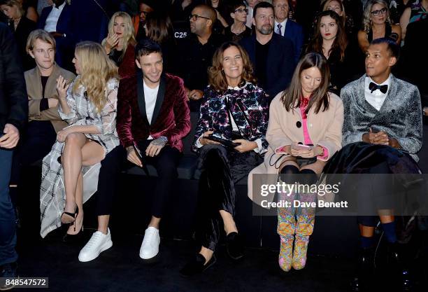 Tom Odell, Ellie Goulding, Liam Payne, Roberta Armani, Coralie Barbier and Stromae sit front row at the Emporio Armani Show on September 17, 2017 in...