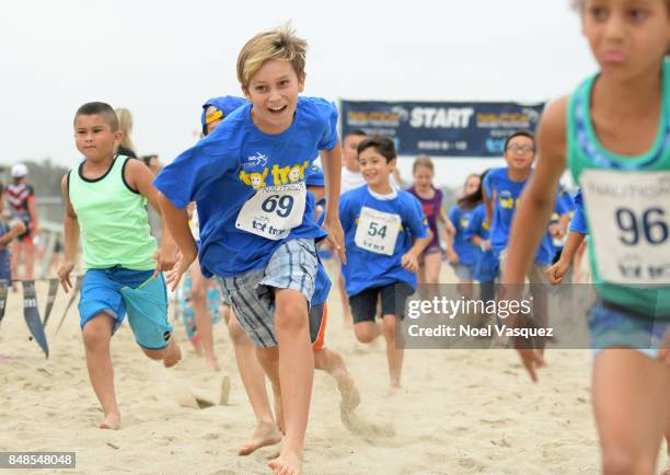 Children participate in the 'Tot Trot' during the Nautica Malibu Triathlon at Zuma Beach on September 17, 2017 in Malibu, California.