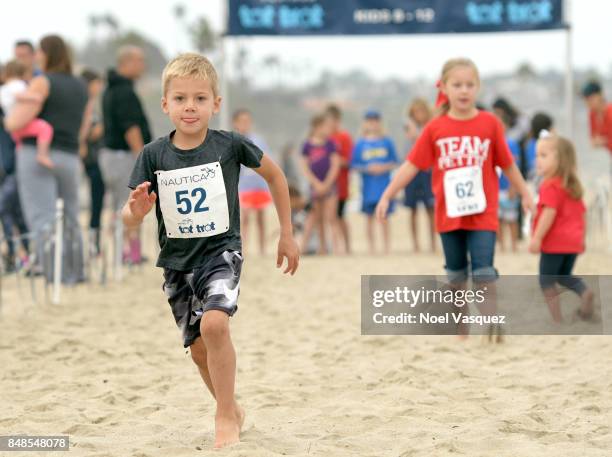 Children participate in the 'Tot Trot' during the Nautica Malibu Triathlon at Zuma Beach on September 17, 2017 in Malibu, California.