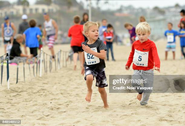 Children participate in the 'Tot Trot' during the Nautica Malibu Triathlon at Zuma Beach on September 17, 2017 in Malibu, California.