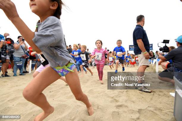 Children participate in the 'Tot Trot' during the Nautica Malibu Triathlon at Zuma Beach on September 17, 2017 in Malibu, California.