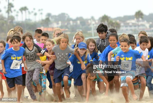 Children participate in the 'Tot Trot' during the Nautica Malibu Triathlon at Zuma Beach on September 17, 2017 in Malibu, California.