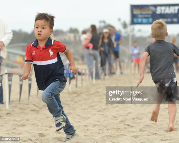 Children participate in the 'Tot Trot' during the Nautica Malibu Triathlon at Zuma Beach on September 17, 2017 in Malibu, California.