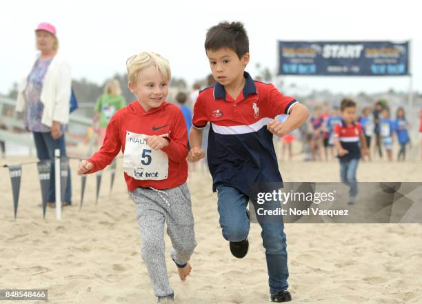 Children participate in the 'Tot Trot' during the Nautica Malibu Triathlon at Zuma Beach on September 17, 2017 in Malibu, California.