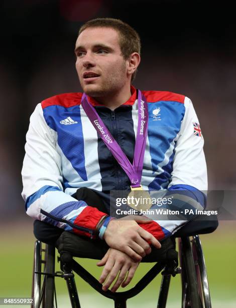 Great Britain's Mickey Bushell celebrates winning Gold in the Mens 100m - T53 at the Olympic Stadium, London.