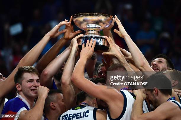 Slovenia's players raise the trophy after winnig the FIBA Eurobasket 2017 men's Final basketball match between Slovenia and Serbia at Sinan Erdem...