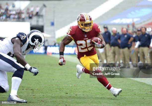 Chris Thompson of the Washington Redskins leaps for the pylon to score a touchdown over Maurice Alexander of the Los Angeles Rams during the second...