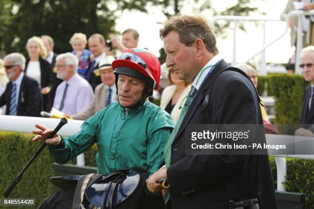 Keiren Fallon, jockey of Steeler, talks with trainer Mark Johnston after winning the Peter Willett Stakes at Goodwood Racecourse, Chichester.