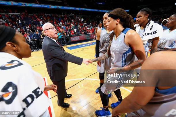Mike Thibault of the Washington Mystics shakes hands with Seimone Augustus and Maya Moore of the Minnesota Lynx after the game in Game Three of the...
