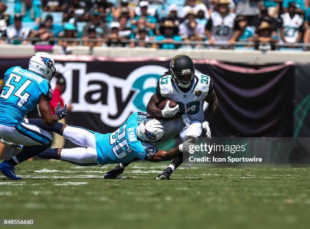 Tennessee Titans cornerback Logan Ryan tackles Jacksonville Jaguars running back Chris Ivory during the game between the Tennessee Titans and the...