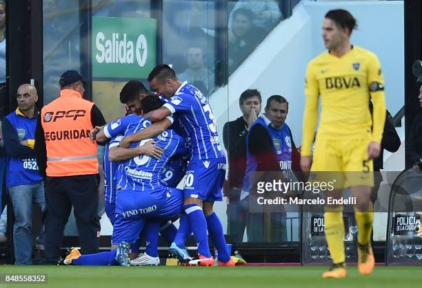 Leonel Galeano of Godoy Cruz celebrates with teammates after scoring the first goal of his team during a match between Boca Juniors and Godoy Cruz as...