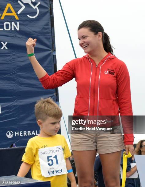 Actress Heather Tom participates in the Nautica Malibu Triathlon at Zuma Beach on September 17, 2017 in Malibu, California.