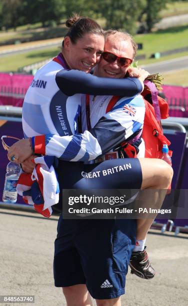 Great Britain's Sarah Storey celebrates with husband Barney following victory in the Women's Individual C5 Time Trial at Brands Hatch, Kent.