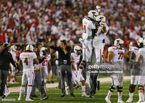 Texas Tech defensive back T.J. Vasher and wide receiver Antoine Wesley celebrate a blocked punt during the Texas Tech Raider's 52-45 victory over the...