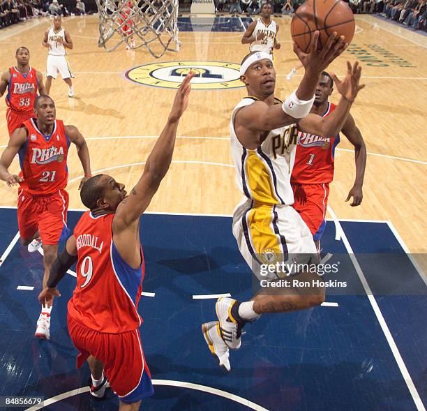 Ford of the Indiana Pacers lays the ball up over Andre Iguodala of the Philadelphia 76ers at Conseco Fieldhouse on February 17, 2009 in Indianapolis,...
