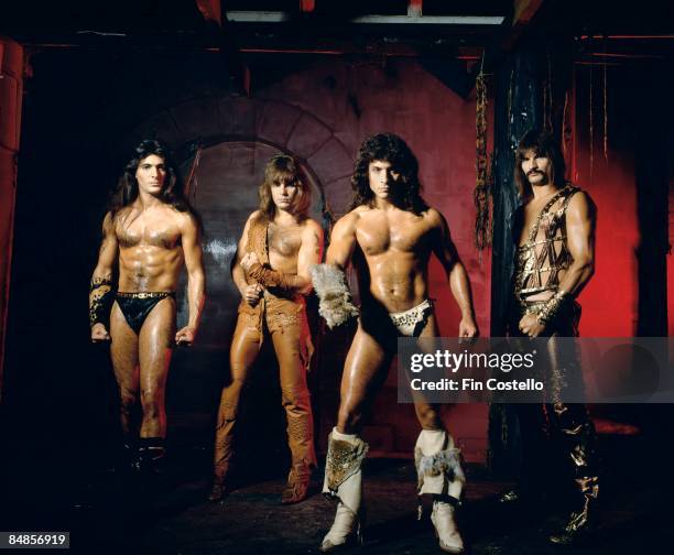 Photo of Scott COLUMBUS and Ross FRIEDMAN and MANOWAR and Joey DeMAIO and Eric ADAMS; Posed studio group portrait, full length, barechested L-R Joey...
