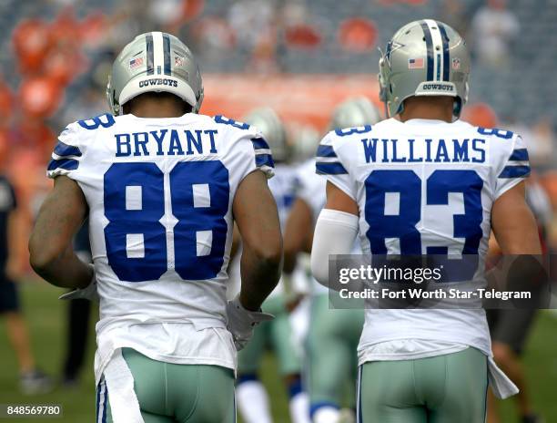 Dallas Cowboys wide receiver Dez Bryant and wide receiver Terrance Williams take the field before a game against the Denver Broncos on Sunday, Sept....