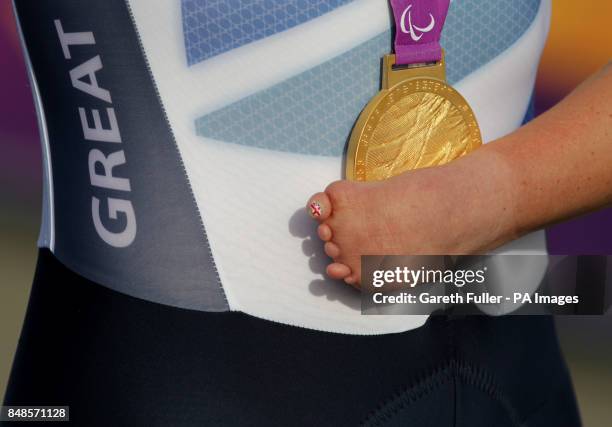 Great Britain's Sarah Storey celebrates on the podium with her gold medal after winning the Women's Individual C 4-5 Road Race at Brands Hatch in...