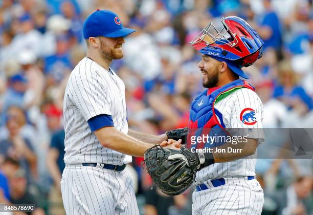 Wade Davis of the Chicago Cubs and Rene Rivera celebrate their win over the St. Louis Cardinals at Wrigley Field on September 17, 2017 in Chicago,...