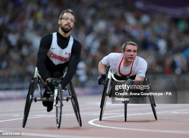 Great Britain's Mickey Bushell reacts after he crosses the line to finish fourth in the Men's 200m T53 Final at the Olympic Stadium, during the...