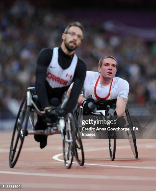 Great Britain's Mickey Bushell reacts after he crosses the line to finish fourth in the Men's 200m T53 Final at the Olympic Stadium, during the...