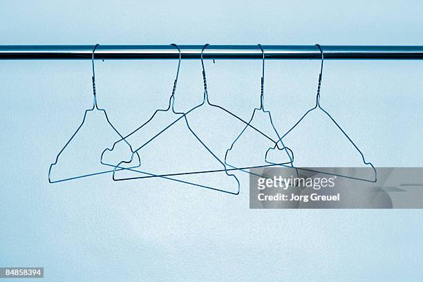 wire clothes hangers - hangar stock pictures, royalty-free photos & images