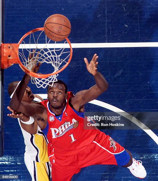 Samuel Dalembert of the Philadelphia 76ers battles T. J. Ford of the Indiana Pacers at Conseco Fieldhouse on February 17, 2009 in Indianapolis,...