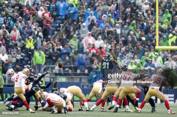 Kicker Robbie Gould of the San Francisco 49ers scores a 37 yard field goal past the defense of cornerback Jeremy Lane of the Seattle Seahawks and...