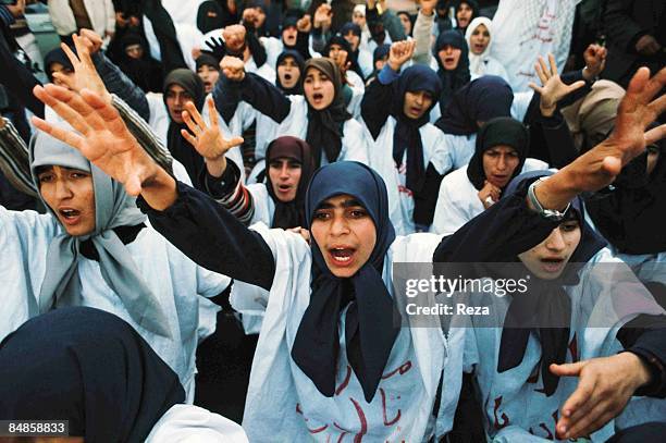 Demonstration by the supporters of the religious leader of the 1979 Iranian revolution; Ruhollah Musavi Khomeini. The white fabric over their clothes...