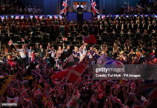 The audience waves flags as medal winning athletes from Team GB join the stage at the Royal Albert Hall, during the finale to the BBC Last Night of...