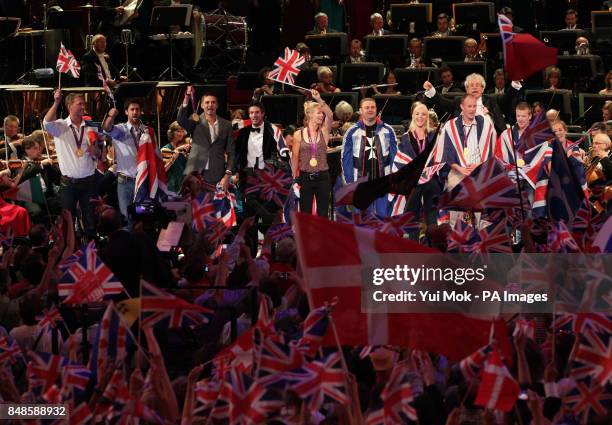 The audience waves flags as medal winning athletes from Team GB join the stage at the Royal Albert Hall, during the finale to the BBC Last Night of...