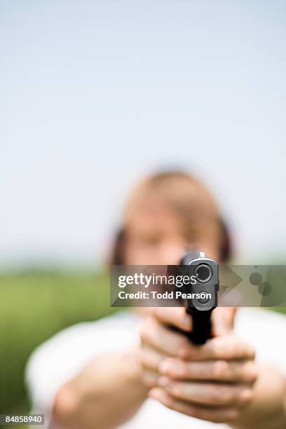 99 Revolver And Pointing At Camera Stock Photos, High-Res Pictures, and ...