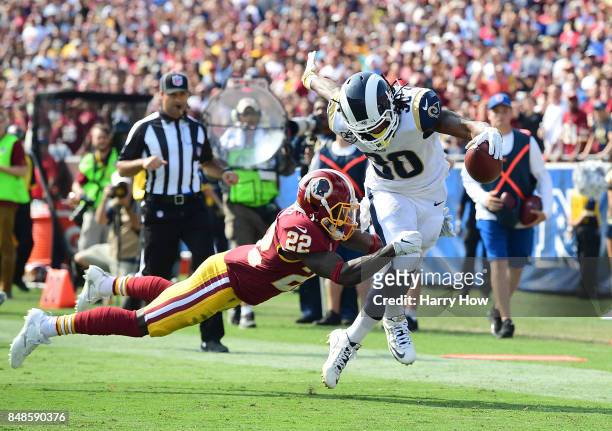 Todd Gurley of the Los Angeles Rams evades Deshazor Everett of the Washington Redskins during the third quarter at Los Angeles Memorial Coliseum on...