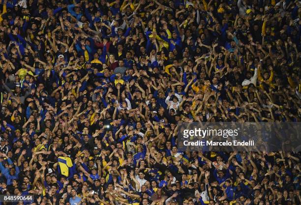 Fans of Boca Juniors cheer for their team during a match between Boca Juniors and Godoy Cruz as part of Superliga 2017/18 at Alberto J. Armando...