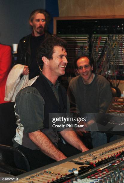 Photo of Mel GIBSON, Mel Gibson sitting at mixing desk listening to soundtrack of Braveheart film