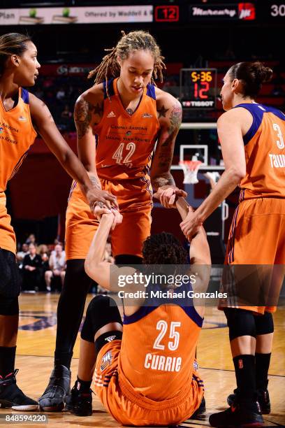 Monique Currie of the Phoenix Mercury gets helped up by Brittney Griner, Diana Taurasi and Camille Little of the Phoenix Mercury in Game Three of the...