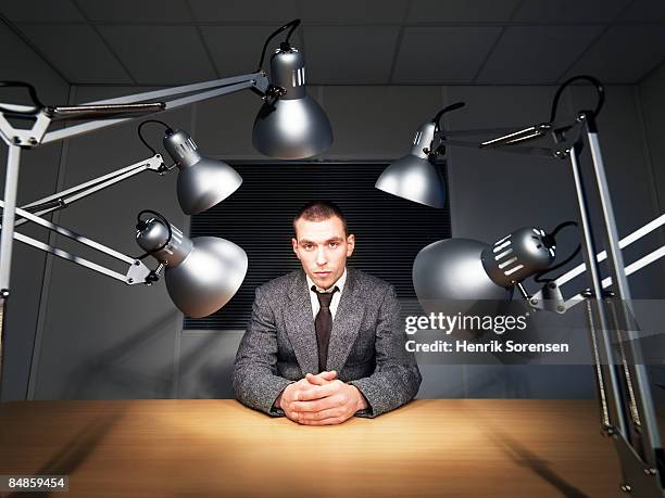 man being interrogated. - interrogated stock pictures, royalty-free photos & images